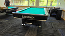 Brunswick Gold Crown VII Black finish pool table with brunswick green cloth end view